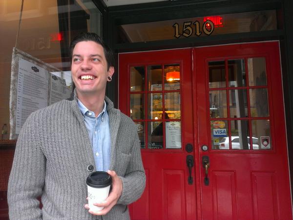 julien smith holding coffee just before speaking at Social Media Breakfast Montreal event